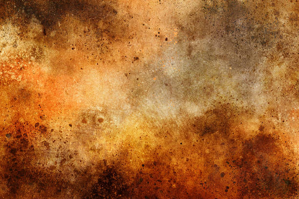 A heavily textured surface displays warm brown, orange, and rust tones with scattered dark spots, stains, and varied weathering patterns creating an abstract grunge composition. The surface represents the organic beauty of natural aging processes, where time and elements transform materials into rich, complex textures full of visual interest and artistic character.