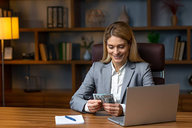 istock Young blonde woman ecommerce business worker counting dollars at 2229487016