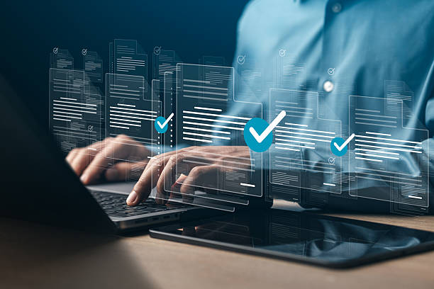 istock Businessman doing online survey to fill out digital document form for business performance review, document management concept, online document database and digital filing system or software. 2229491964