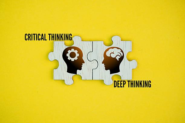 istock Wooden puzzle with Two things or words: Critical thinking and Deep thinking. related but distinct cognitive processes. Critical thinking involves analyzing information objectively to form a judgment 2229492925