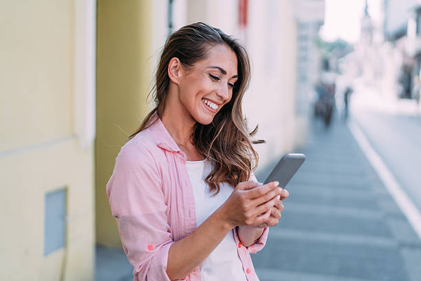 istock Woman using smartphone outdoors. 2229493632