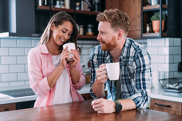 istock Lovely couple drinking coffee at home. 2229493669