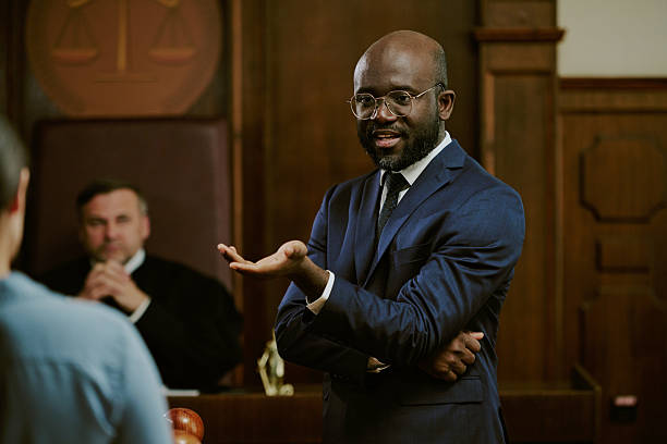 istock Middle Aged Black Man Explaining Legal Argument in Courtroom during Trial 2229494738