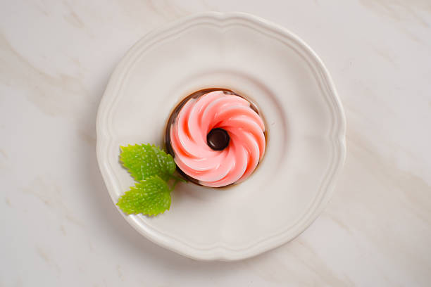 striped donut on white plate, close up, isolated on white background