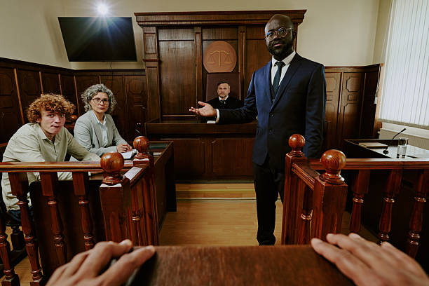 istock Black Middle Aged Man Presenting Legal Argument in Courtroom Setting 2229496232