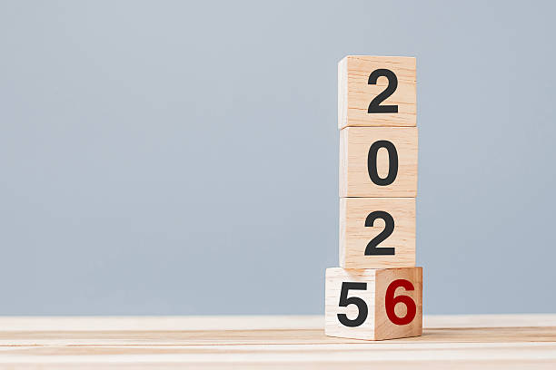 istock 2025 chang to 2026 wooden cube blocks on table background. Resolution, plan, review, goal, start, end year  and New Year holiday concepts 2229496623