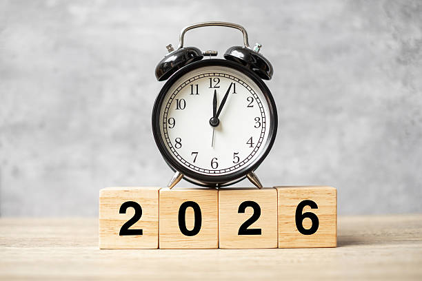 istock 2026  text with clock on table. Resolution, time, plan, goal, motivation, reboot, countdown and New Year holiday concepts 2229496662