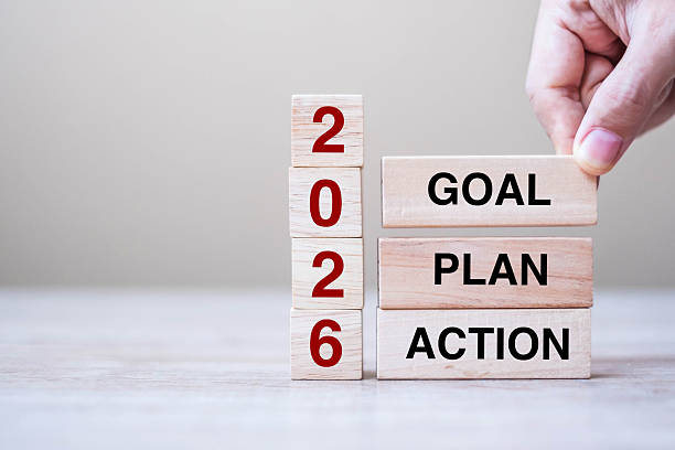 istock hand holding wooden block with text 2026 GOAL, PLAN and ACTION on table background. Resolution, strategy, solution, goal, business and New Year holiday concepts 2229496758