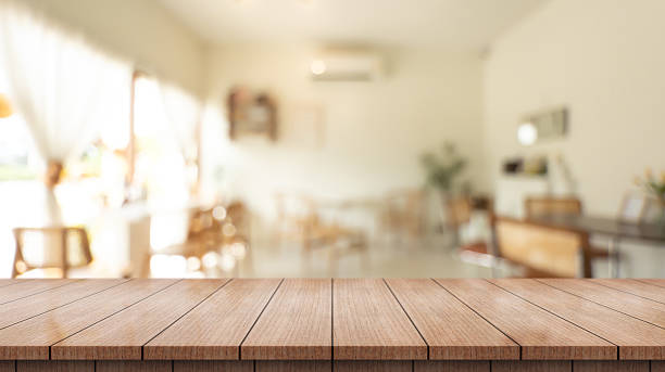 istock Empty wooden table top with lights bokeh on blur restaurant background 2229499787