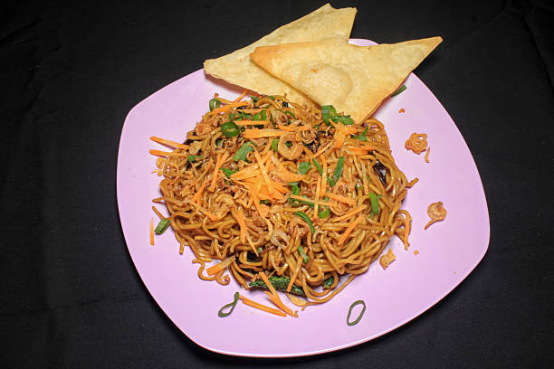 istock Traditional Indonesian Fried Noodles (Mie Goreng) with Crispy Wonton 2229500333