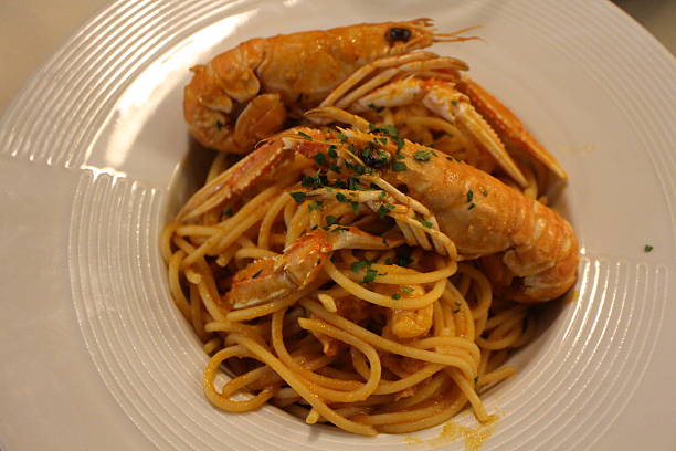 istock Italian cuisine: spaghetti alla busara (spaghetti with scampi and tomato sauce) in Venice, Italy 2229502641