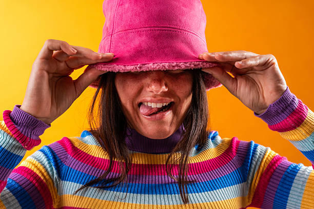 istock Young woman expressing playful style in studio portrait 2229504352