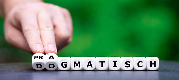 istock A image depicting the shift from dogmatic to pragmatic thinking,symbolized by turning dice. Dice form the German word 'dogmatisch' (dogmatic) and 'pragmatisch' (pragmatic). 2229509476