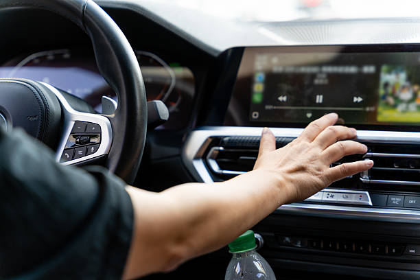 istock Hand touching the LCD screen in the car 2229514333