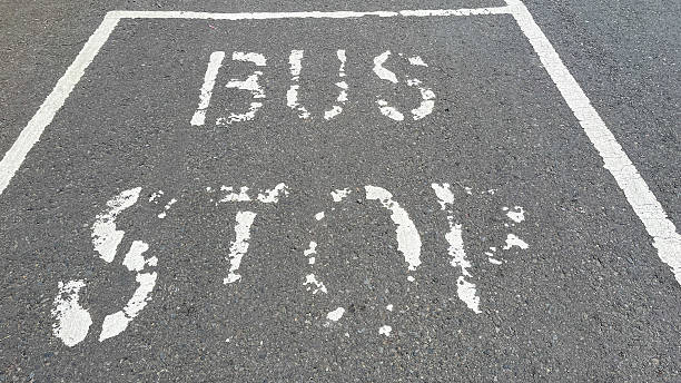 Bus inscription on the asphalt, public transport lane, autobus stop or parking sign