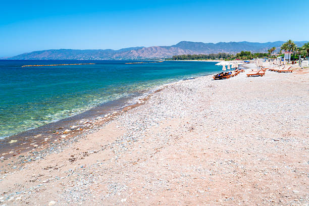 istock White sandy beach with sun loungers in Latchi, Cyprus. 2229518993