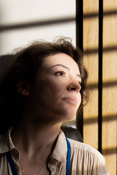 istock Stylish confident entrepreneur looking out the window during golden hour 2229519596