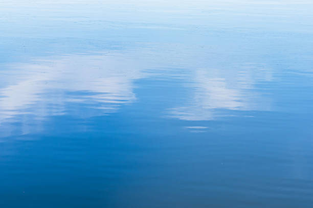 I photographed the sky reflected on the surface of the river on a sunny morning in May.