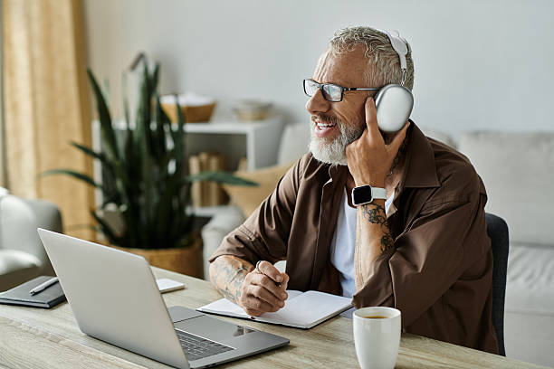 istock Charming senior man engaged in a lively conversation while working from his cozy home office 2229520510