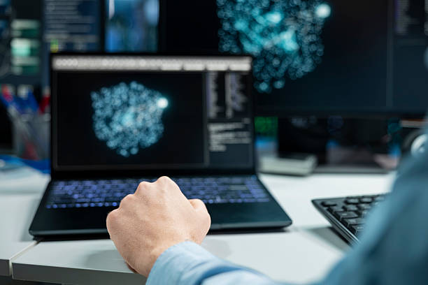 istock Close up of data center developer using laptop, monitoring AI systems 2229522343
