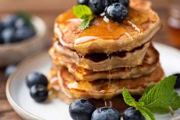 istock Pancakes with drizzling honey and blueberries 2229523344