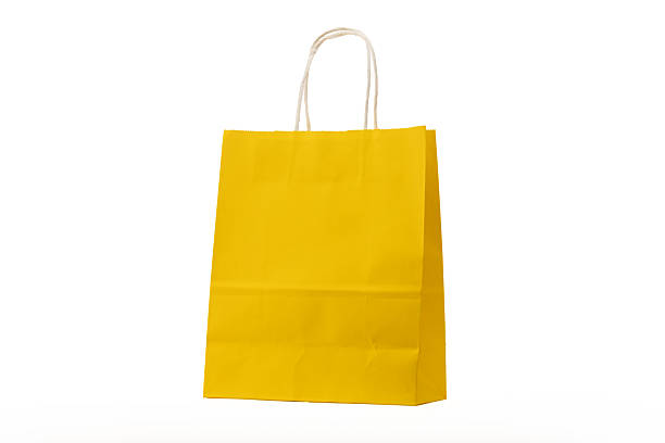 istock Yellow shopping bag on white background 2229532368