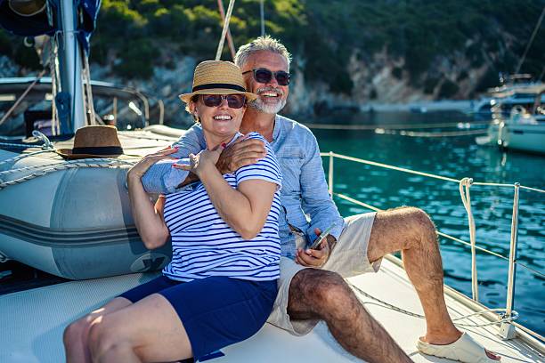 istock Senior couple in love sailing together 2229532394