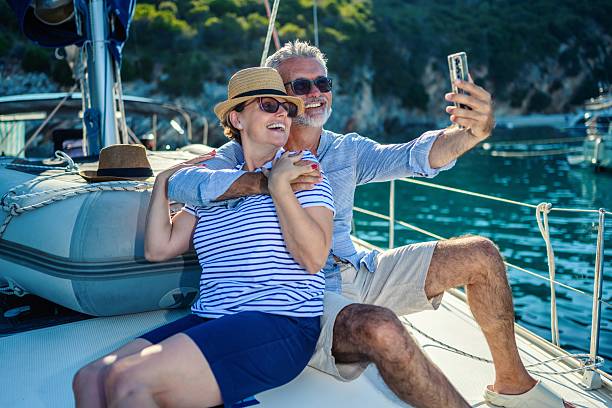 istock Senior couple taking a selfie on a sailboat 2229534081