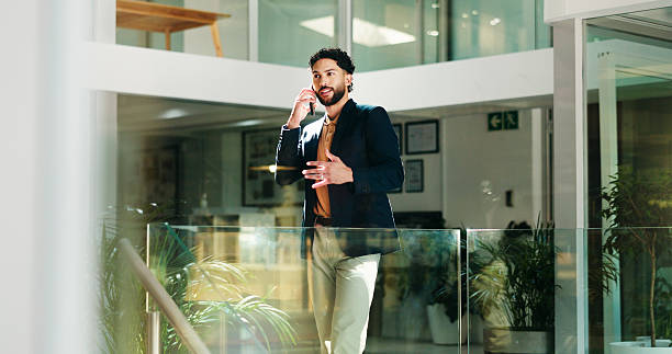 istock Businessman, discussion and office with phone call for negotiation or proposal at workplace. Man, employee or financial advisor talking on mobile smartphone for corporate deal, chat or conversation 2229535242