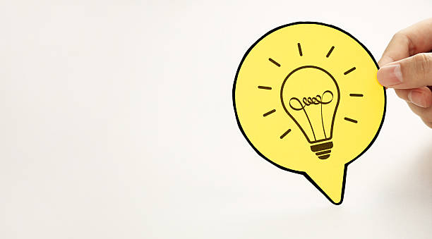 istock Hand holding a circle paper with light bulb icon. Represents new idea generation. 2229535597