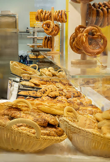 istock Freshly baked goods displayed in a bakery with various breads and pastries in woven baskets 2229535708