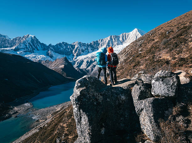 istock Backpacking hikers hiking on high altitude mountain top 2229536773
