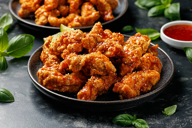 istock Korean fried chicken with spicy sauce and sesame seeds 2229538809