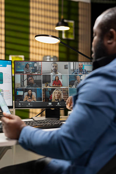 istock African american man attending a meeting on remote video call 2229540489