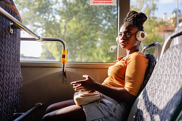 istock Modern Urban Commuter Woman Using Smartphone on Public Transit 2229540501