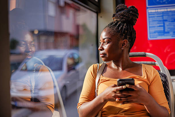 istock Stylist Lady Sitting on Bus Using Smartphone 2229540560