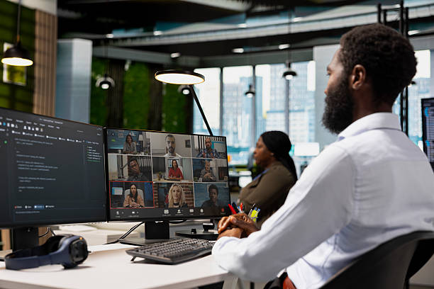 Tech company office coworkers working together via videocall