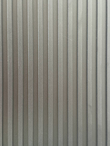 Unique textural exploration with lines and patterns captured in soft gray tones