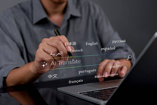 istock person in a modern workspace using a pen on a laptop, working with AI translation tools to translate text into languages like French, Spanish, and Japanese, promoting seamless global interaction. 2229542311