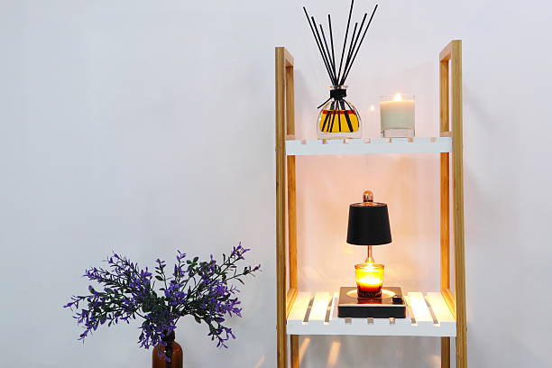 luxury lighting aroma scented candle on nice table in bedroom for creating good relax ambient on Valentine day with beautiful background room , candle making process natural soy wax candles , design glass tealight candle