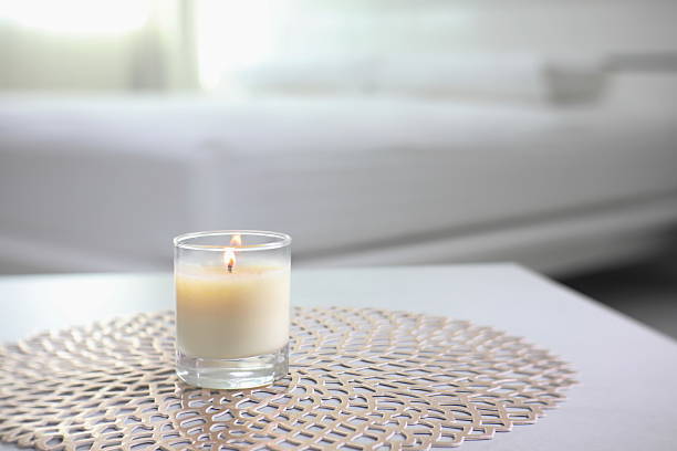 istock luxury aroma scented candle on nice table in bedroom for creating good relax ambient on Valentine day 2229543935