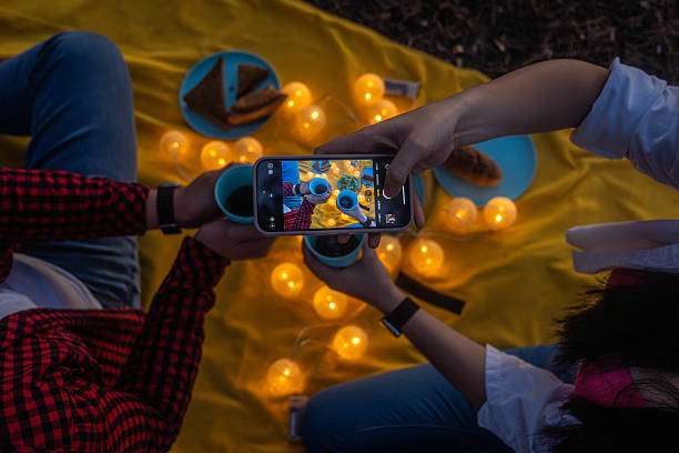 istock Taking a Photo of Picnic Toast with String Lights 2229544162