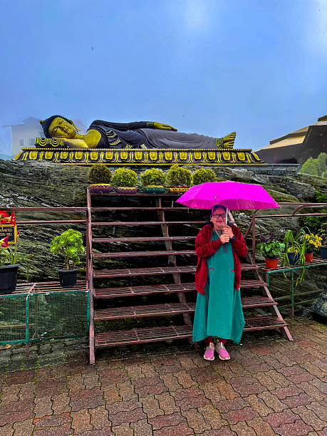 istock lady tourist is posing at Ravangla Buddha park 2229544702
