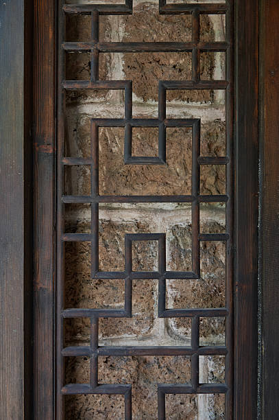 Intricate Geometric Wood Lattice Pattern with Stone Wall Backdrop