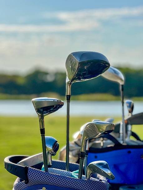 istock Golf Clubs in Bag on Cart – Course View Blurred in Background 2229547253