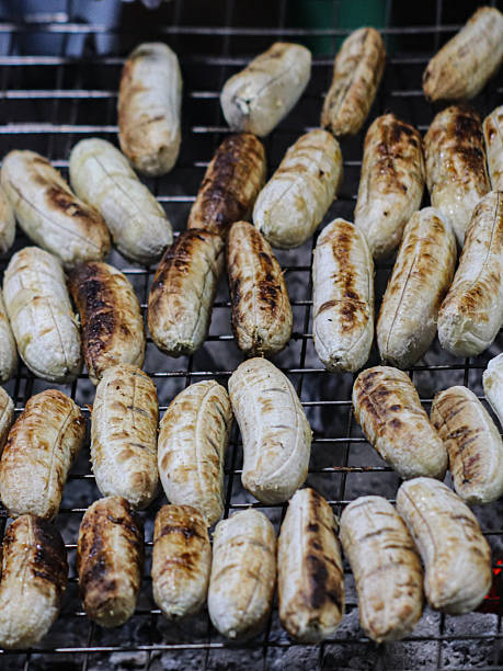 Charcoal-grilled Thai bananas, a sweet street snack.