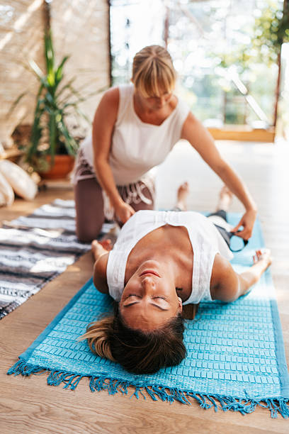 istock Reiki master transfers energy to the client body 2229552189