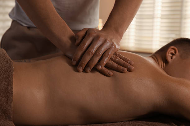 istock Massage therapist working with patient in clinic, closeup 2229552308