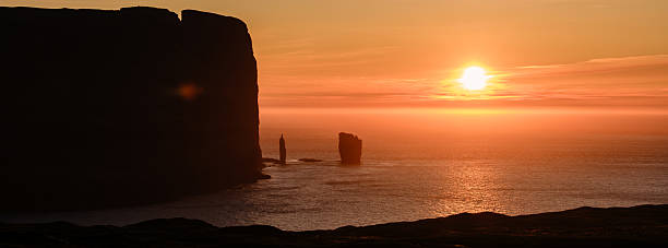 istock Majestic sunset over Risin og Kellingin cliffs in Faroe Islands creates enchanting scenery 2229552899