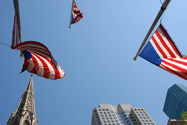 American flags above st patrick cathedral ny